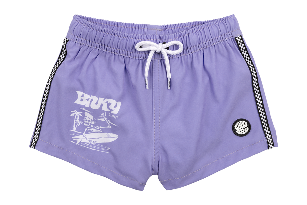 Our Skelly Swimmie features purple swim trunks with a surfing skeleton. Our Swimmies are styled after a more euro-fit. Meaning, the length of the shorts will land anywhere between a little above the knee to mid-thigh-ish. Shop more of our toddler swimsuits.