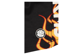 Close-up of a black fabric featuring bold stamped flame graphics and the BinkyBro logo, ideal for stylish kids' apparel.
