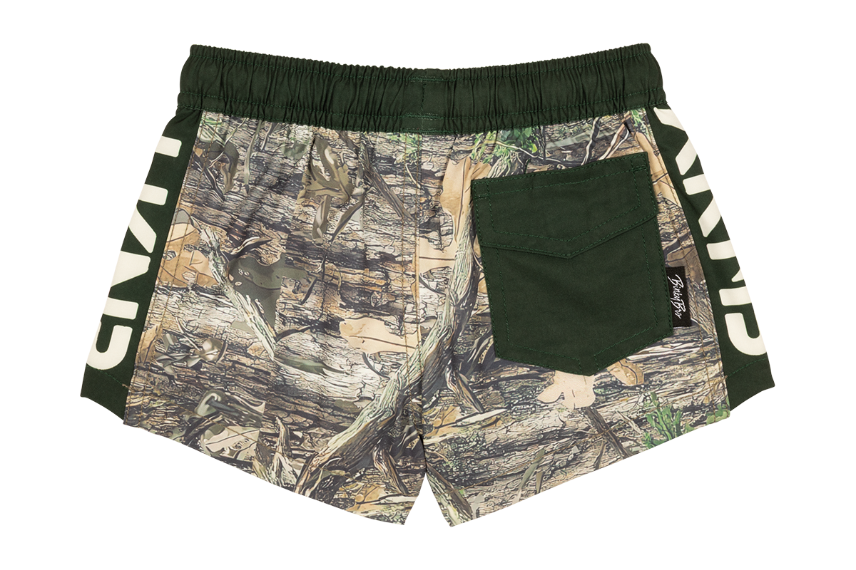 Stylish green shorts featuring a stamped forest camouflage design and a back pocket, perfect for active youth.