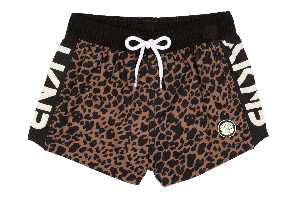 Stylish leopard print swim shorts with a black waistband and white drawstring, featuring bold branding on the sides.