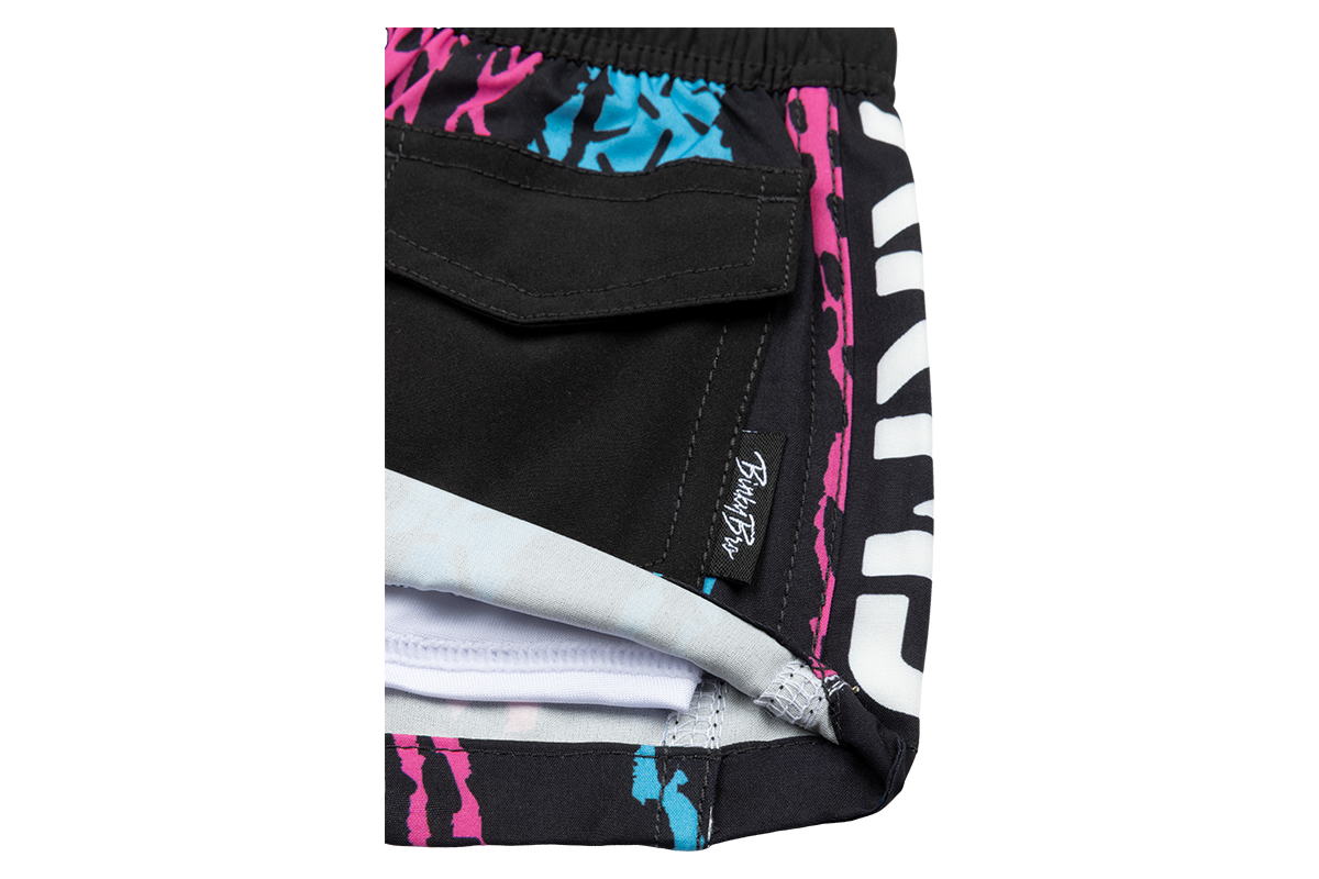 Stylish black swim trunks featuring vibrant pink and blue stamped designs, perfect for kids' summer adventures.