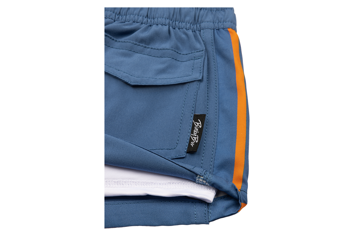 Stylish blue summer shorts with orange accents and BinkyBro logo tag, perfect for active kids.